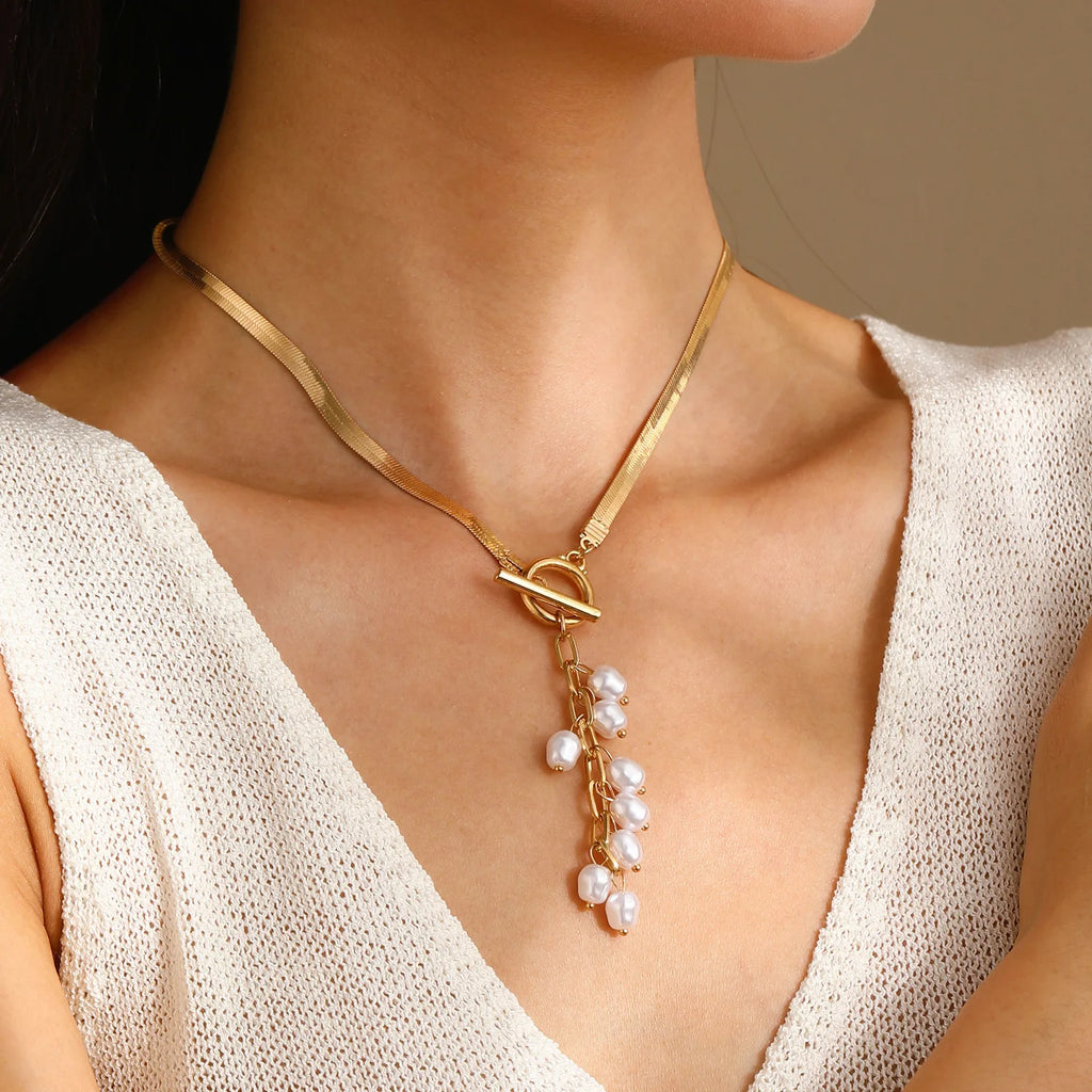 Marvelle Sculpted Knot Tassel Necklace