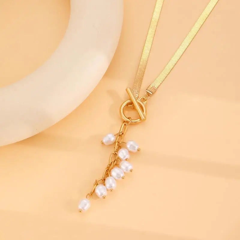 Marvelle Sculpted Knot Tassel Necklace